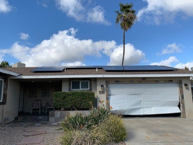 Damaged garage door on an East County home, a repair job